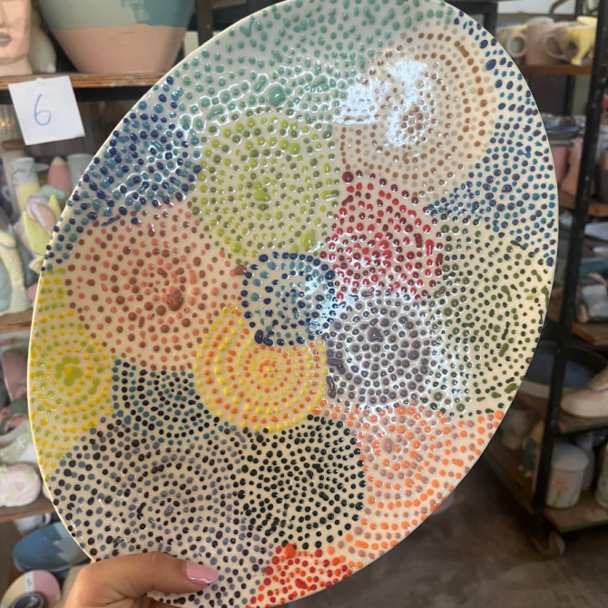 Finished painted pottery piece at Clay Cafe Hout Bay, ideal for family-friendly activities and group events.