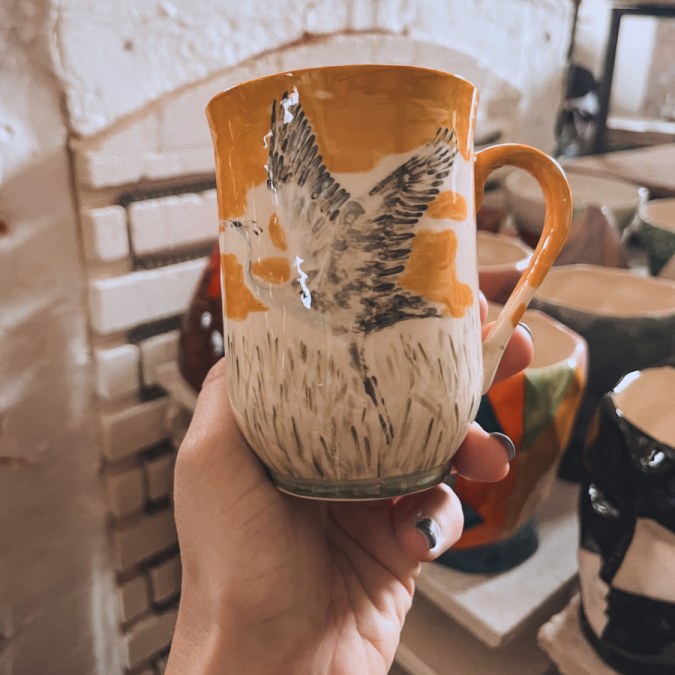 Painted pottery cup from Sip and Paint session at Clay Cafe Hout Bay.