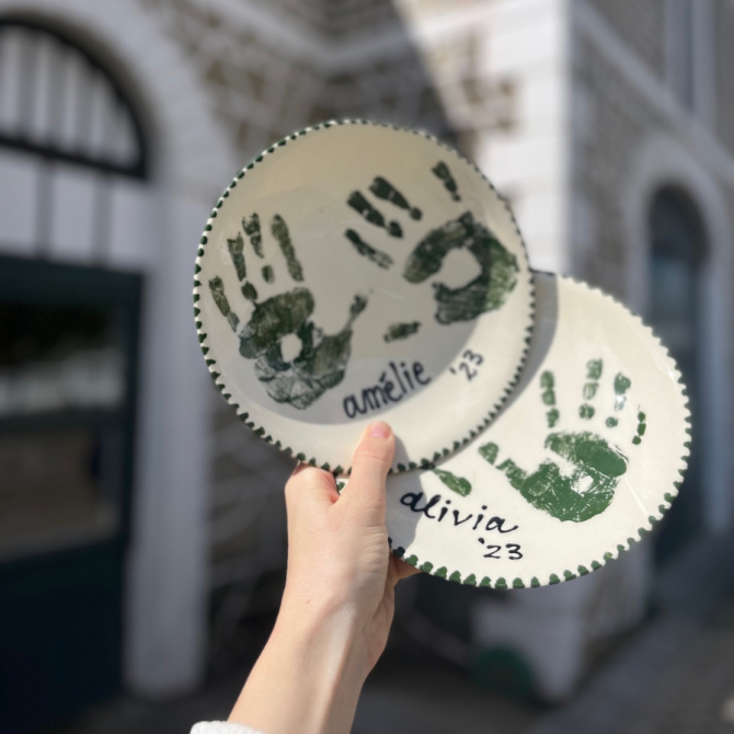 A vibrant, hand-painted pottery piece created at Clay Cafe in the City. A fun indoor activity for family-friendly gatherings and team-building events.