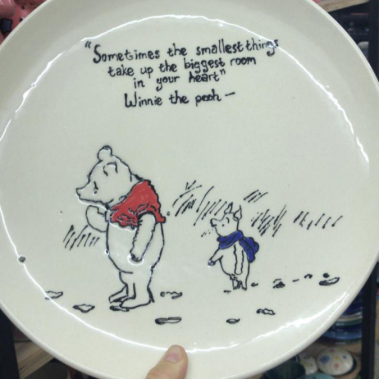 Painted plate of Winnie the Pooh at Clay Cafe Hout Bay, ideal for family-friendly activities.