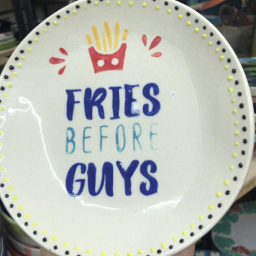 Close-up of a hand-painted plate created during a family-friendly activity at Clay Cafe Paarl.